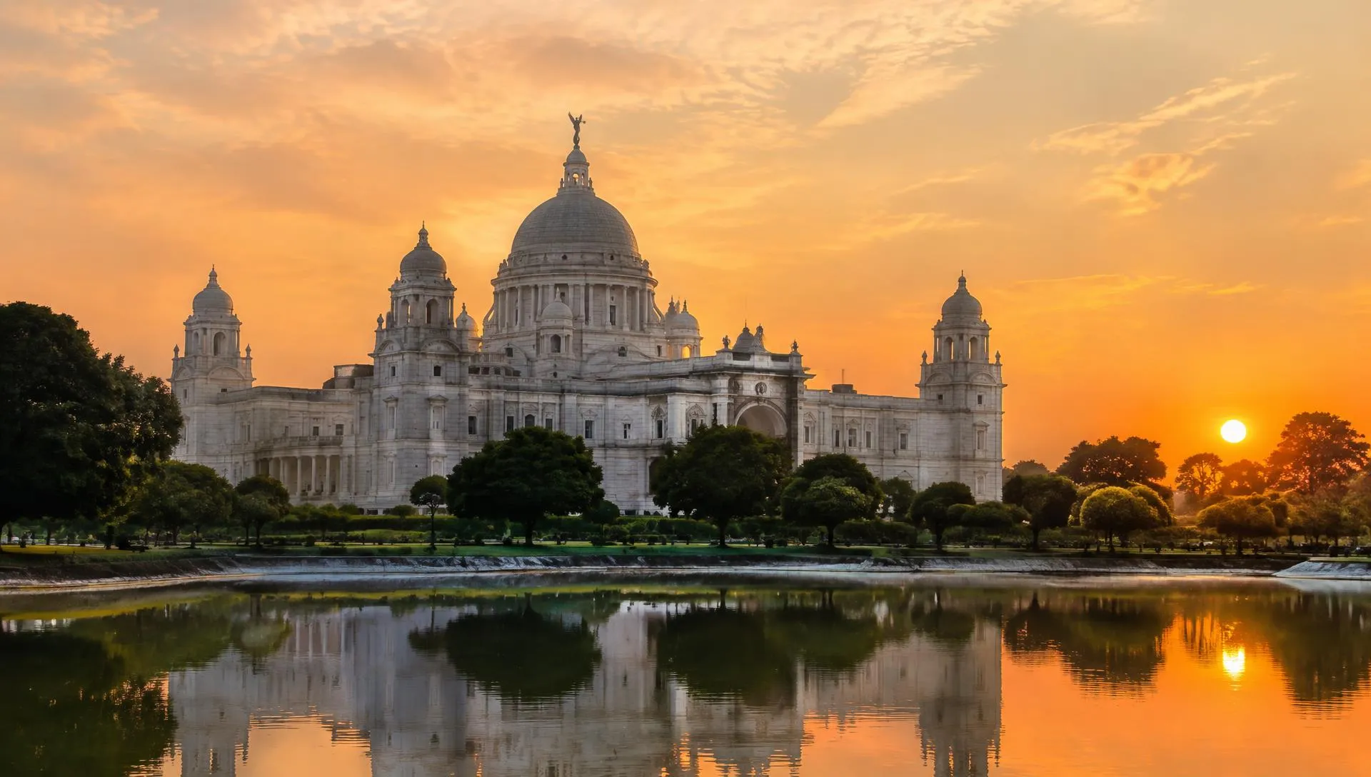 Victoria Memorial reflected in its pond at sunset in Kolkata